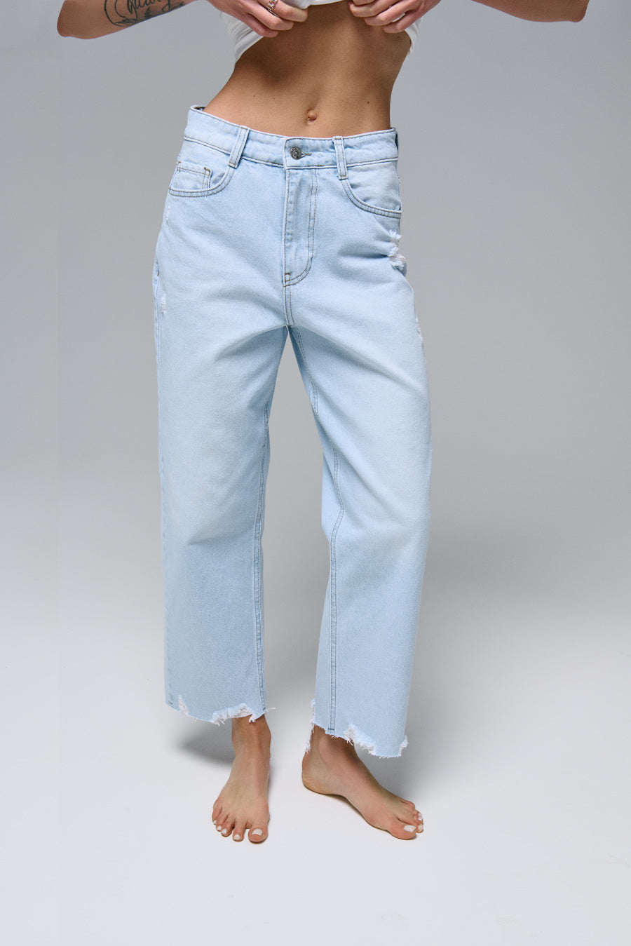 STRAIGHT jeans in light blue color with distressed details